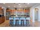 Spacious kitchen featuring a large island with bar seating, custom cabinets, and modern appliances at 1808 E Crocus Ave, Queen Creek, AZ 85140
