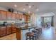 Spacious kitchen with granite countertops, tile backsplash, and stainless steel appliances at 1808 E Crocus Ave, Queen Creek, AZ 85140