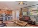 View of open living room that opens to kitchen and covered patio at 1808 E Crocus Ave, Queen Creek, AZ 85140