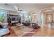 Spacious living room with tile flooring, comfortable leather furniture, and an entertainment center at 1808 E Crocus Ave, Queen Creek, AZ 85140
