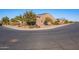 Street view of a corner home with desert landscaping, mature trees, and visible neighborhood at 1808 E Crocus Ave, Queen Creek, AZ 85140