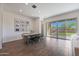 Dining room with a dining table, photo wall, and large sliding doors at 18509 W Galveston St, Goodyear, AZ 85338