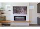 Close-up view of the fireplace with decorative shelves and TV at 18509 W Galveston St, Goodyear, AZ 85338