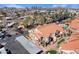 High angle aerial view of a community with landscaped grounds, carports, red tiled roofs and community pool at 1905 E University Dr # 216, Tempe, AZ 85288