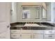 Bathroom featuring vanity with granite countertop and white cabinets at 1905 E University Dr # 216, Tempe, AZ 85288