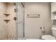 Bathroom featuring a tiled walk-in shower with glass doors and chrome fixtures at 1905 E University Dr # 216, Tempe, AZ 85288