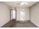 Bedroom with ceiling fan, neutral carpet, and access to bathroom and closet at 1905 E University Dr # 216, Tempe, AZ 85288