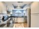 Chef's kitchen with stainless steel appliances and granite countertops, perfect for cooking and entertaining at 1905 E University Dr # 216, Tempe, AZ 85288