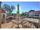A cozy patio with outdoor seating, offering views of the community and surrounding trees at 1905 E University Dr # 216, Tempe, AZ 85288