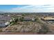 Expansive aerial view of a home with a pool, desert landscaping, and a white picket fence at 19910 W Amelia Ave, Buckeye, AZ 85396