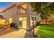 Evening view of home exterior and backyard patio at 21004 N 53Rd Ave, Glendale, AZ 85308