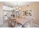 Formal dining room with chandelier and large table at 21004 N 53Rd Ave, Glendale, AZ 85308