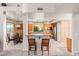 Kitchen with granite countertops, wood cabinets, and an island at 21004 N 53Rd Ave, Glendale, AZ 85308