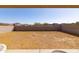 Large empty backyard space, ready for landscaping and personalization at 34395 N Cherrystone Dr, San Tan Valley, AZ 85144