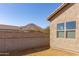Backyard view featuring desert landscaping and block wall at 34395 N Cherrystone Dr, San Tan Valley, AZ 85144