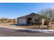 Charming single-story home featuring a two-car garage and desert landscaping at 34395 N Cherrystone Dr, San Tan Valley, AZ 85144