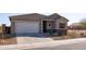 Inviting single-Gathering home with a well-kept lawn and a spacious two-car garage at 34395 N Cherrystone Dr, San Tan Valley, AZ 85144