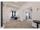 Welcoming foyer with white decor leads to a spacious living area, enhancing the home's elegance at 34395 N Cherrystone Dr, San Tan Valley, AZ 85144