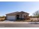 Charming single-story home with a two-car garage, a neutral color palette, and manicured landscaping at 34395 N Cherrystone Dr, San Tan Valley, AZ 85144