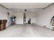 A clean and spacious two-car garage featuring ample room for storage and parking at 34395 N Cherrystone Dr, San Tan Valley, AZ 85144