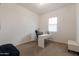 Home office featuring a black desk chair, white desk, and window offering natural light at 34395 N Cherrystone Dr, San Tan Valley, AZ 85144