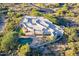Expansive aerial view showcasing the pool, putting green, and architectural design of the desert home at 37870 N 98Th Pl, Scottsdale, AZ 85262