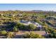 Beautiful aerial shot of an estate in a golf community with mountain views in the background at 37870 N 98Th Pl, Scottsdale, AZ 85262