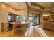 Entertainment bar area with barstool seating and granite countertops, with outside views to enjoy at 37870 N 98Th Pl, Scottsdale, AZ 85262