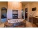 Luxurious bathroom featuring a soaking tub, fireplace, granite counters, and a built-in vanity at 37870 N 98Th Pl, Scottsdale, AZ 85262
