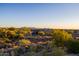 Desert home with a natural landscape and breathtaking mountain views in the distance at 37870 N 98Th Pl, Scottsdale, AZ 85262