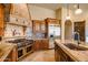 Gourmet kitchen includes stainless steel appliances and custom wood cabinetry at 37870 N 98Th Pl, Scottsdale, AZ 85262