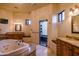 Luxurious main bathroom features a jetted tub and dual vanities at 37870 N 98Th Pl, Scottsdale, AZ 85262