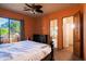 Main bedroom features outdoor access, ensuite bath, and traditional design elements at 37870 N 98Th Pl, Scottsdale, AZ 85262