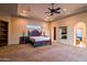 Spacious main bedroom features a fireplace and tray ceiling at 37870 N 98Th Pl, Scottsdale, AZ 85262