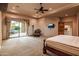 Bright main bedroom with patio access and view of the backyard at 37870 N 98Th Pl, Scottsdale, AZ 85262