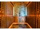 Custom wine cellar with stone accent wall and bottle storage at 37870 N 98Th Pl, Scottsdale, AZ 85262