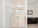 Modern bathroom showcasing a glass-enclosed shower and vanity with dark wood cabinets, offering a sleek design at 3833 E Stiles Ln, Gilbert, AZ 85295