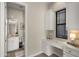 Bathroom featuring a vanity area, cabinets and a large window for natural light at 3882 E Andalusia Ave, Gilbert, AZ 85298