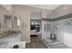 Bathroom with a large shower, neutral colored walls, and an opening to the bedroom at 3882 E Andalusia Ave, Gilbert, AZ 85298