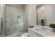Modern bathroom features tiled shower with glass door, sleek vanity, and stylish fixtures at 3882 E Andalusia Ave, Gilbert, AZ 85298