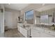 Bright bathroom featuring a tub, dual sinks, and a large window for plenty of natural light at 3882 E Andalusia Ave, Gilbert, AZ 85298