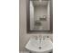 Charming powder room featuring a modern vanity with decorative mirror and elegant fixtures at 3882 E Andalusia Ave, Gilbert, AZ 85298