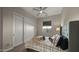 Cozy bedroom featuring a ceiling fan, closet with sliding doors, and a window for natural light at 3882 E Andalusia Ave, Gilbert, AZ 85298