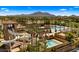 Stunning aerial view showcasing a resort-style waterpark and pool area nestled within a beautiful community at 3882 E Andalusia Ave, Gilbert, AZ 85298