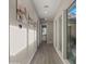 Bright hallway with flower wall art and tile floors at 3882 E Andalusia Ave, Gilbert, AZ 85298
