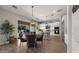 Open concept kitchen with white cabinets, granite countertops, and stainless steel appliances at 3882 E Andalusia Ave, Gilbert, AZ 85298