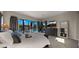 Relaxing bedroom with a dark wood bed frame, carpet flooring, and sliding door to the backyard with pool at 3882 E Andalusia Ave, Gilbert, AZ 85298