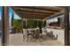 Covered outdoor kitchen and dining area with grill and entertainment area at 3882 E Andalusia Ave, Gilbert, AZ 85298