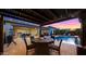 Beautiful outdoor living space with a fire pit, outdoor kitchen, and sparkling pool perfect for entertaining at 3882 E Andalusia Ave, Gilbert, AZ 85298