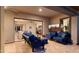 Stylish covered patio with comfortable seating, a ceiling fan, and access to indoor living spaces at 3882 E Andalusia Ave, Gilbert, AZ 85298